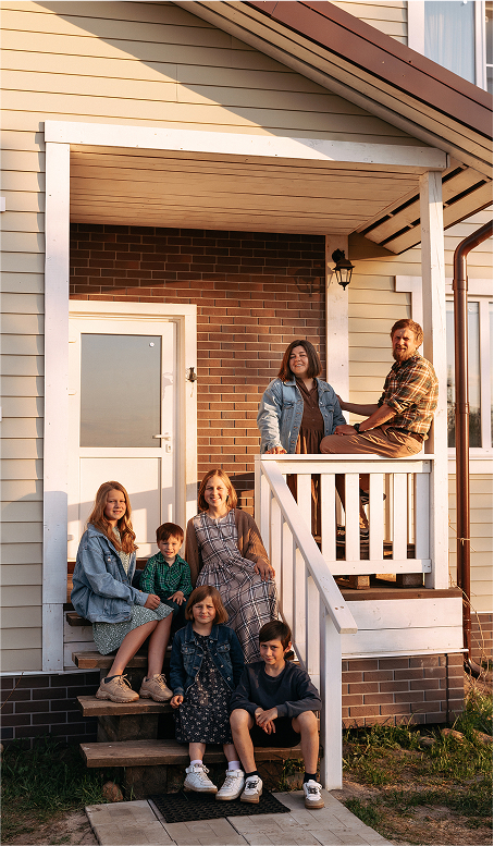 family sitting on their porch